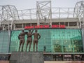 United Trinity facing the Sir Matt Busby at Old Trafford