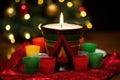 unity cup surrounded by seven kwanzaa candles