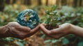 In unity, a man and a woman hold miniature globe and a fresh sprout, significance of Earth Day Royalty Free Stock Photo