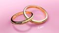 Golden connected wedding rings with inscribed love word that symbolize unity, love, caring and marriage bond