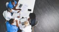 Unity, teamwork and brainstorming by health care workers researching online while having a meeting in conference room Royalty Free Stock Photo