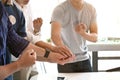 Unity and teamwork concept; Cropped shot of start up business people putting their hands together. Royalty Free Stock Photo