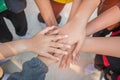 Unity and teamwork Concept: Group of friends hands together. Top view of Asian young people putting their hand together as Friends Royalty Free Stock Photo