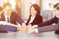 Unity and teamwork concept of young business people folding their hands together Royalty Free Stock Photo