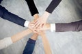 Unity and teamwork concept of young business people folding their hands together Royalty Free Stock Photo