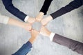 Unity and teamwork concept of young business people folding their hands together Royalty Free Stock Photo