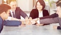 Unity and teamwork concept of young business people folding their hands together Royalty Free Stock Photo