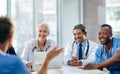 Unity, teamwork and happy health care workers having a meeting in a conference room. Diverse doctors discussing modern Royalty Free Stock Photo