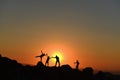 The joy of success of the climbers at sunrise time Royalty Free Stock Photo