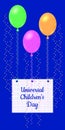 Universal Childrens Day. The air balloons kept the sheet from the school notebook in a cage, on which the name of the event is wri Royalty Free Stock Photo