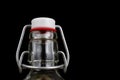 Universal closure of a beverage bottle. Airtight cap closing transparent glass container. Royalty Free Stock Photo