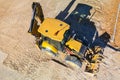 Universal excavator or loader with folded bucket at construction site. Universal construction equipment. Rental of construction Royalty Free Stock Photo