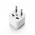Universal travel adapter plug on white background Royalty Free Stock Photo