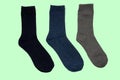 Universal warm socks on green background. Royalty Free Stock Photo