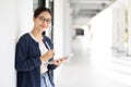 University Asian teen girl using tablet online learning modern education lifestyle in school campus Royalty Free Stock Photo