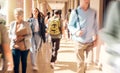 University, campus and busy students walking to class for learning, studying and education. College, crowd and group of Royalty Free Stock Photo