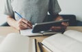University or college student using tablet for studying, learning or reading textbook online at home. Success idea of self Royalty Free Stock Photo