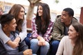 University, community and people chat on campus in conversation, talking and laughing outdoors. Diversity, education and Royalty Free Stock Photo