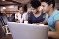 University, education and students in library on laptop for research, studying and learning on website. Online, college Royalty Free Stock Photo