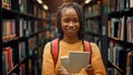University Library Study: Portrait of a Smart Beautiful Black Girl Holding Study Text Books Smilin Royalty Free Stock Photo