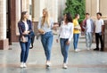 University life. Girls walking after classes outdoors Royalty Free Stock Photo