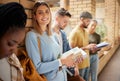 University, lobby and portrait of woman and students standing in row together with books at business school. Friends Royalty Free Stock Photo