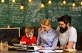 University male speaker conducts business training, Modern teacher hipster writing on big blackboard with math formula Royalty Free Stock Photo