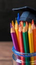 University milestone Colorful pencils with graduation hat, education concept