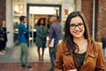 This university is perfect for me. Portrait of a happy young woman standing outdoors on campus. Royalty Free Stock Photo