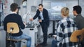 University Robotics Class. White Male Teacher Explaining Engineering to Students Using Robot Arm Royalty Free Stock Photo