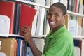 University student choosing book in library Royalty Free Stock Photo