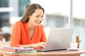 University student e-learning with a laptop in a bar Royalty Free Stock Photo