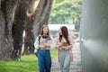 University student girl friends with learning book college while walking in campus Royalty Free Stock Photo