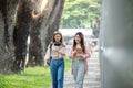 University student girl friends with learning book college while walking in campus Royalty Free Stock Photo