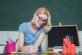 University student going to college. Funny female young teacher in the classroom. Student preparing for test or exam Royalty Free Stock Photo