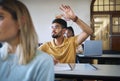 University student, hands and answer question in classroom for teaching, school education or learning. Young man Royalty Free Stock Photo