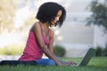 University student using laptop outside