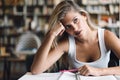 University student girl bored, frustrated and overwhelmed by studying homework Royalty Free Stock Photo