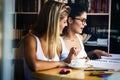 University student girl bored, frustrated and overwhelmed by studying homework Royalty Free Stock Photo