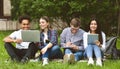 University students with devices preparing for classes