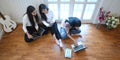 University students are relaxing with a computer laptop and tablet in sitting room.