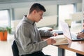 University students sitting together at the table with books and laptop. Happy young people doing group study in library Royalty Free Stock Photo