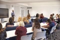 University students study in a classroom with male lecturer Royalty Free Stock Photo