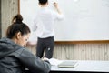 University students study hard and listen to teachers for their lessons with special lectures in the columns of math class