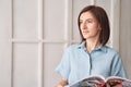 Univetsity research. Pretty woman working at home. Girl portrait with magazine