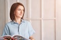 Univetsity research. Pretty woman working at home. Girl portrait with magazine