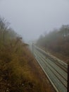 Into the Unknown: The Ambiguous Train Tracks as They Fade into the Fog Royalty Free Stock Photo