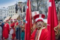 Unknown artists in folk costumes prepare for the performance