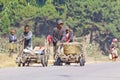 Unknown boys carries a traditional caresa carriage