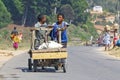 Unknown boys carries a traditional caresa carriage